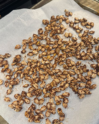 roasted pumpkin seeds from Jack-o'lantern for a green Halloween celebration.