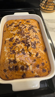 pumpkin bread with chocolate chips, made out of pumpkin guts or pulp from Jack-o'lantern for a green Halloween celebration.