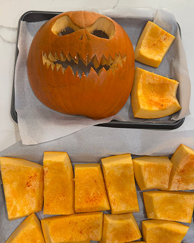 Jack-o’-lantern is on the baking pan and ready to go in the oven for a green Halloween celebration.