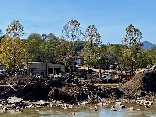 uprooted trees and mud after Hurricane Helene in North Carolina