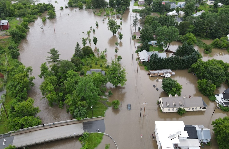 An aerial view of a flooded Dog River Park, in Northfield, Vermont